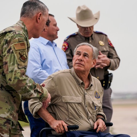 Texas Gov. Greg Abbott talks with Adjutant General of the Texas Military Department Maj. Gen. Thomas Suelzer after a news conference in Austin, Texas on  May 8, 2023.