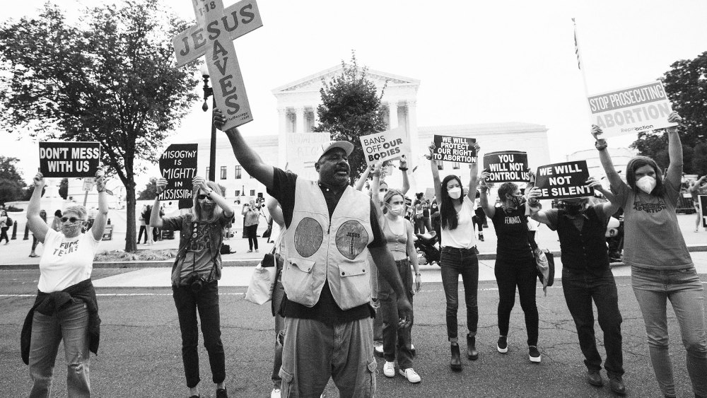 Pro-choice and anti-abortion activists protest alongside each other during a demonstration outside of the Supreme Court on October 04 in Washington, DC.