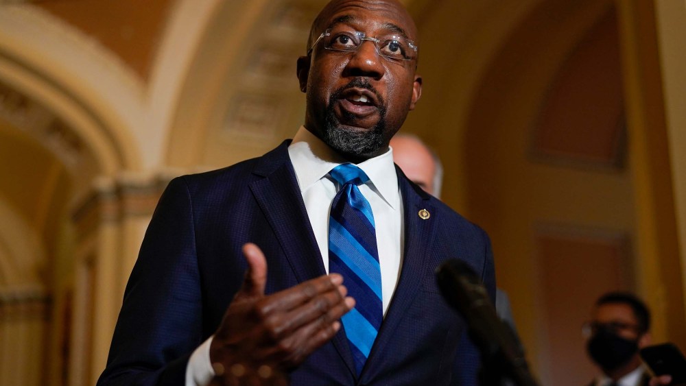 Sen. Raphael Warnock speaks during a news conference after the weekly Democratic policy luncheon on Capitol Hill in Washington on Tuesday, Dec. 7.