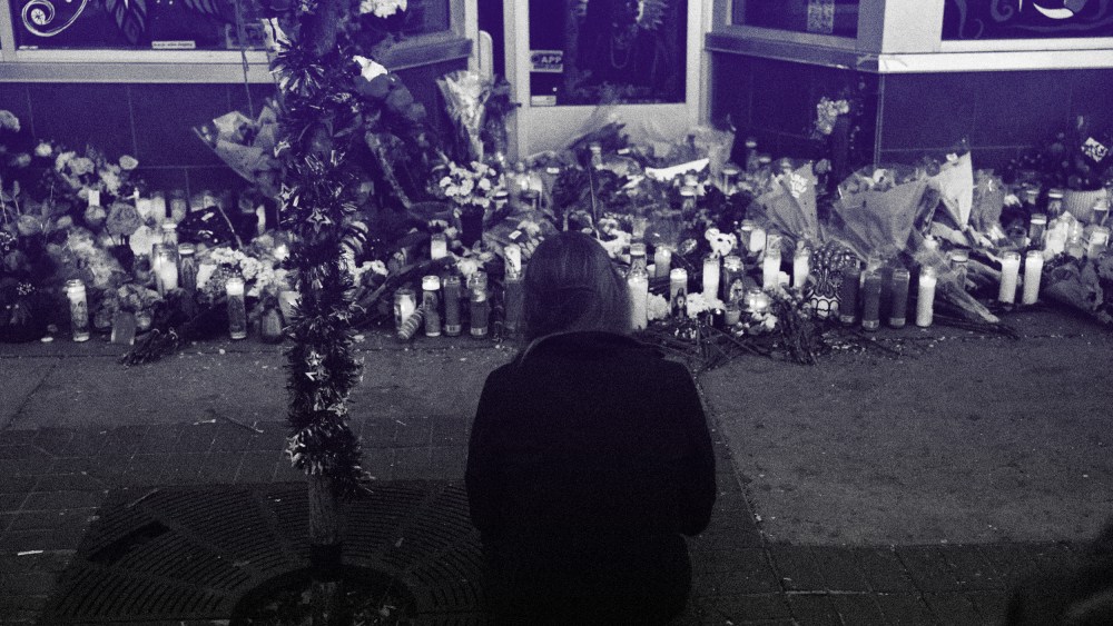Image: A makeshift memorial outside of the tattoo shop where owner Alicia Cardenas was killed during a shooting spree in Denver on Dec. 29, 2021.