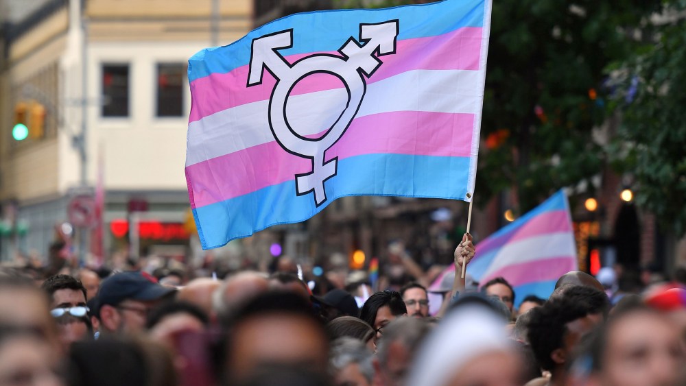 A transgender pride flag is waved outside the Stonewall Inn in New York in 2019.