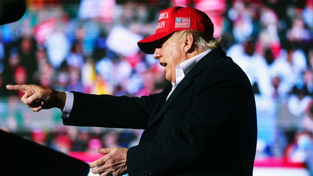 Former President Donald Trump points to the crowd at a rally at the Canyon Moon Ranch festival grounds on January 15 in Florence, AZ.