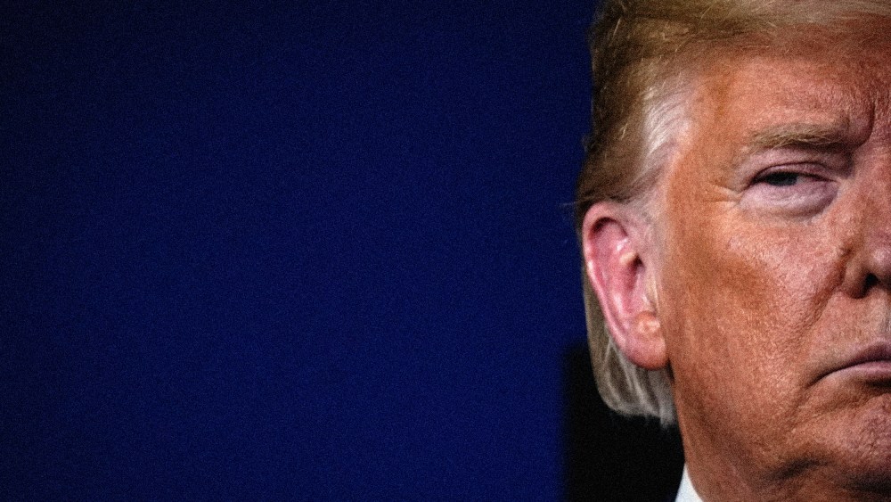 Image: Then-President Donald Trump attends a Covid-19 press briefing at the White House in 2020.