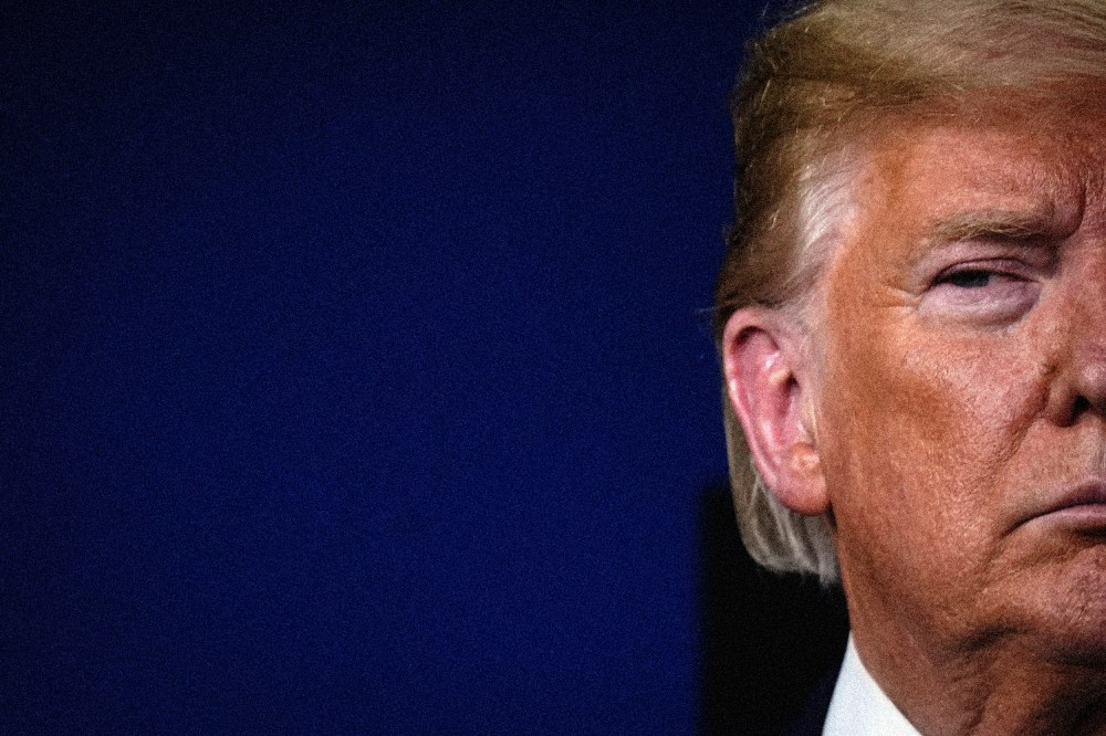 Image: Then-President Donald Trump attends a Covid-19 press briefing at the White House in 2020.