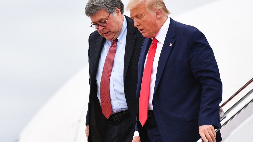Donald Trump and US Attorney General William Barr exit Air Force One upon arrival at Andrews Air Force Base in Maryland on September 1, 2020.