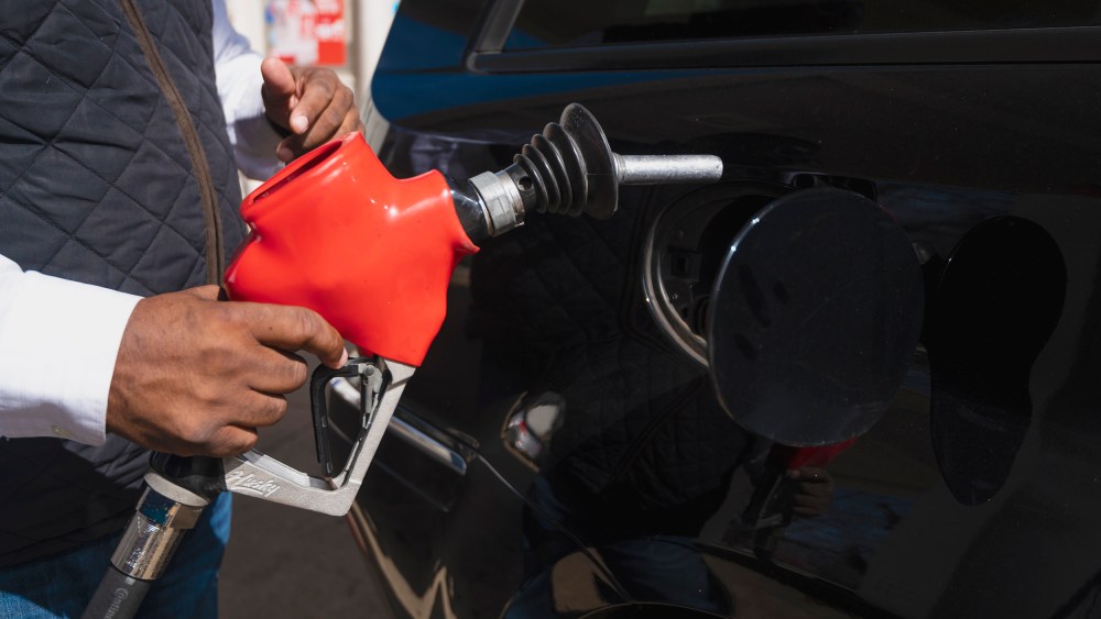 A man pumps gas at an Exxon station in Washington on Tuesday, March 8.