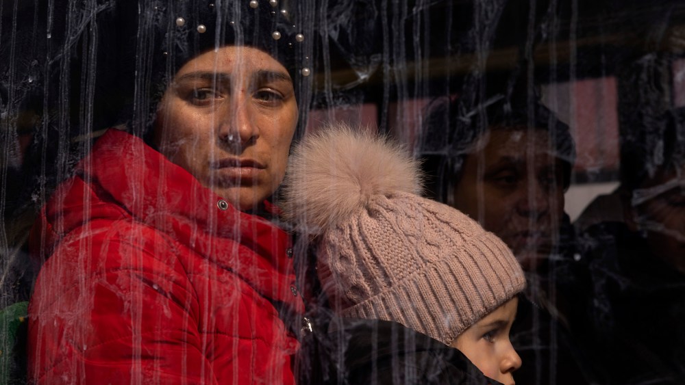 Image: Families board buses to Poland in Lviv, Ukraine, on March 12, 2022.