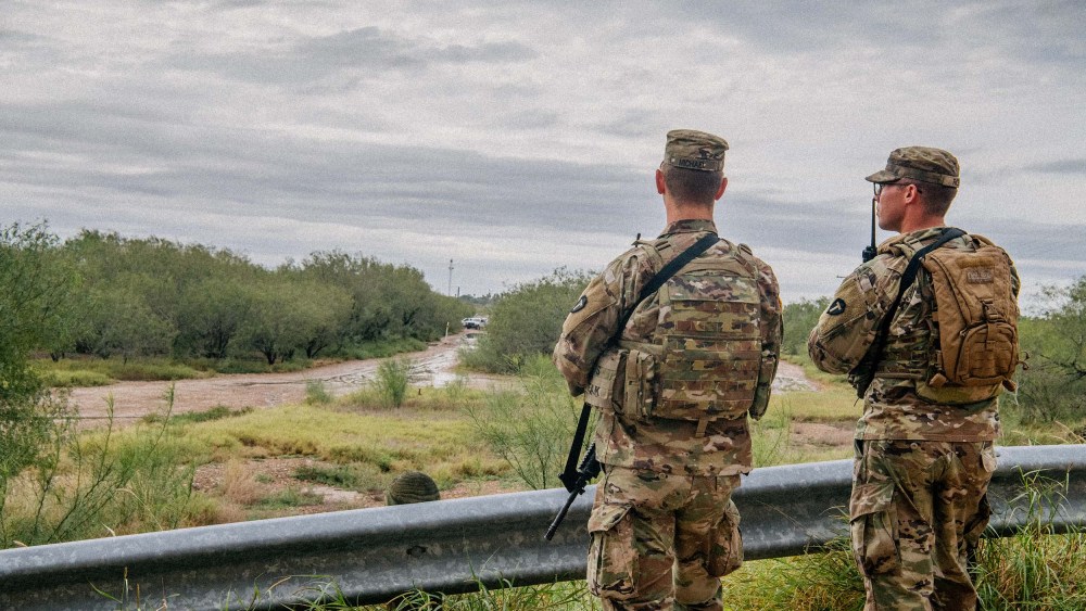 U.S. National Guard members patrol near an unfinished section of border wall on November 18, 2021 in La Joya, Texas.