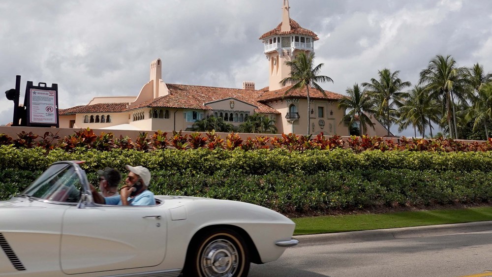 A car passes in front of former President Donald Trump's Mar-a-Lago resort on February 11, 2022 in Palm Beach, Fla.