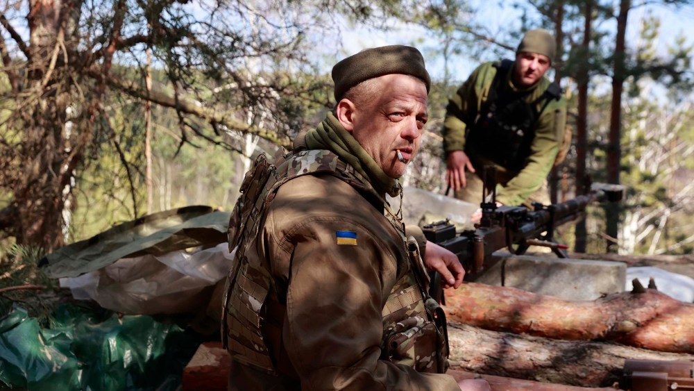 Ukrainian servicemen guard their position near Brovary, north of Kyiv, Ukraine, Thursday, March 17.