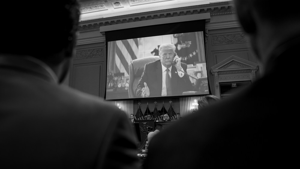 Image: Photos of then-President Donald Trump are showing during a House Select Committee hearing on the attack at the Capitol on Jan. 6 on June 16, 2022.