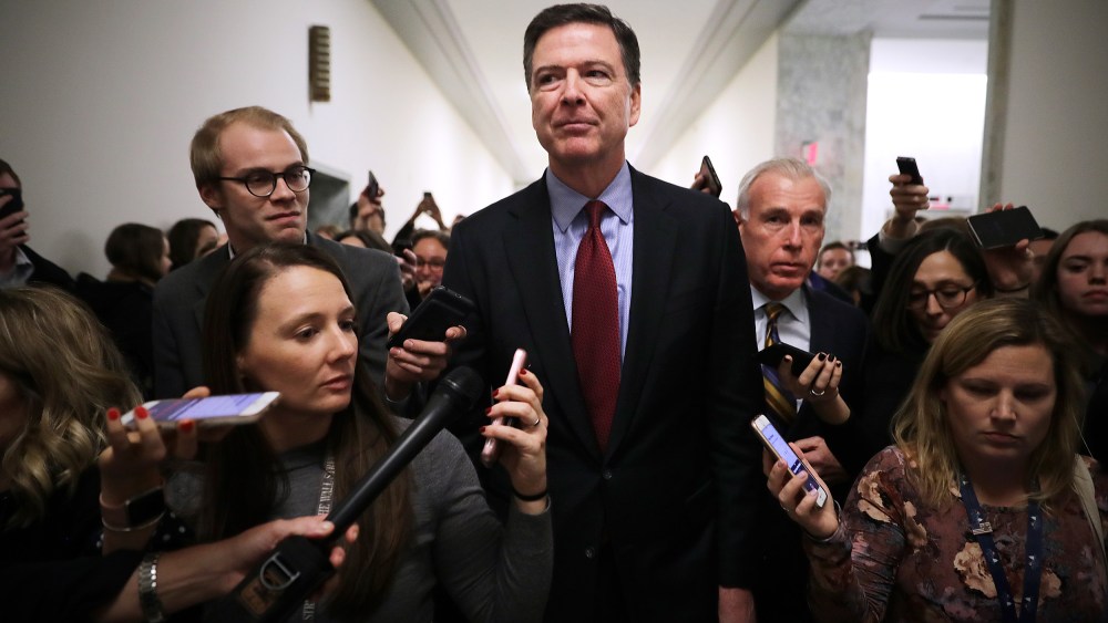 Image: Former FBI Director James Comey is surrounded by reporters after testifying to the House Judiciary and Oversight and Government Reform committees on Capitol Hill in 2018.