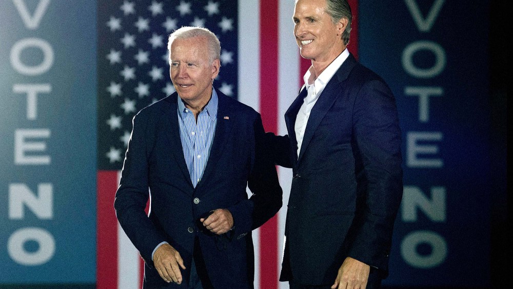 California Governor Gavin Newsom greets US President Joe Biden during a campaign event at Long Beach City College in Long Beach, Calif. on September 13, 2021.