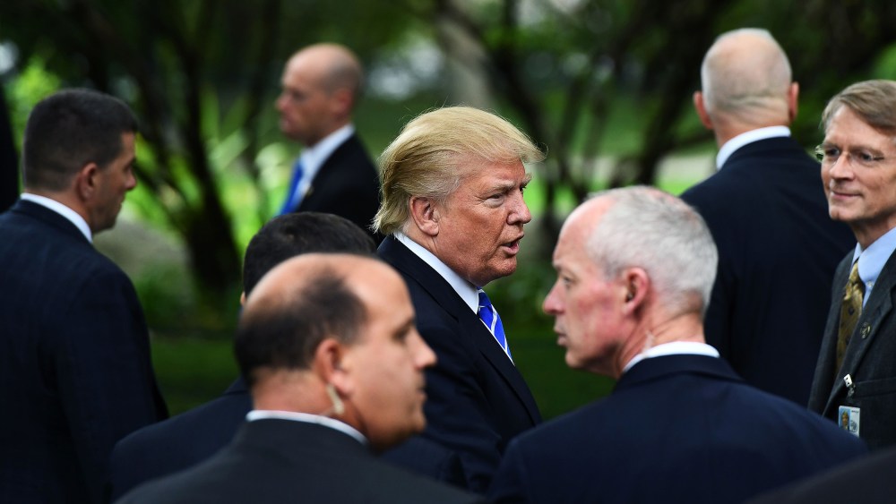 Image: Donald Trump surrounded by members of the Secret Service.