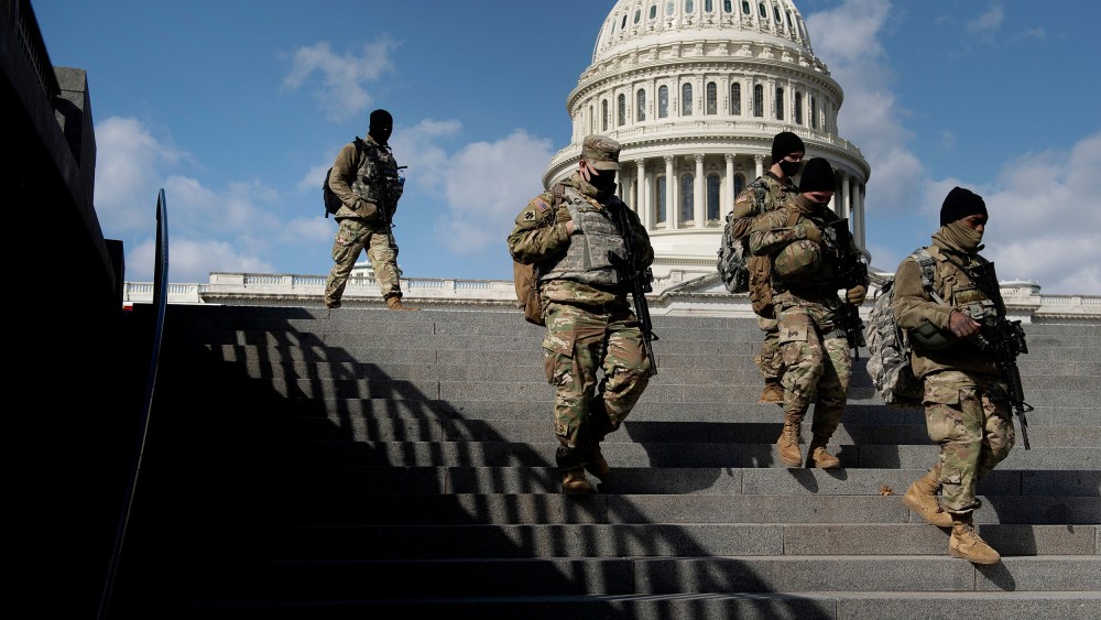 Members of the National Guard patrol the grounds of the US Capitol on March 4, 2021, in Washington, D.C.