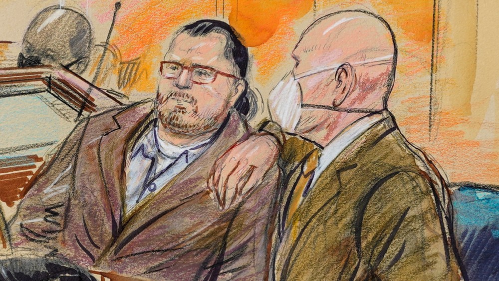 Image: Courtroom sketch of Guy Wesley Reffitt with his lawyer William Welch.