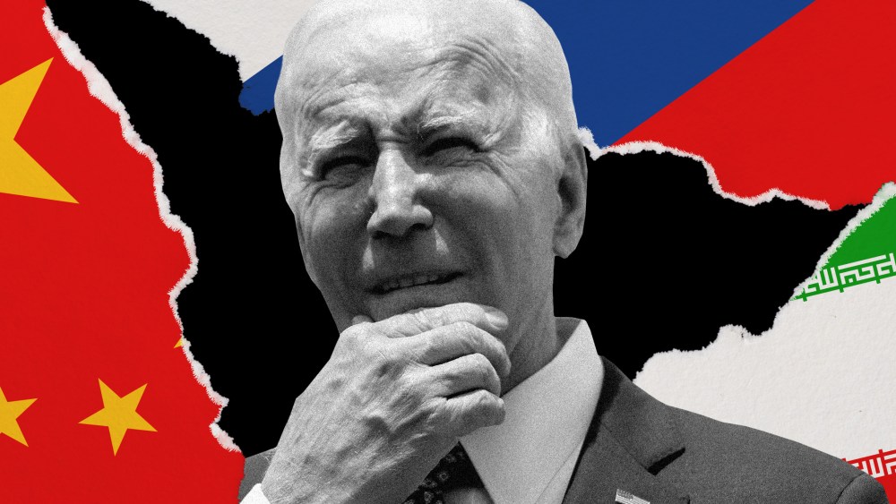 Photo illustration: Joe Biden surrounded by torn paper pieces with the Chinese, Russian and Iranian flags on three sides.