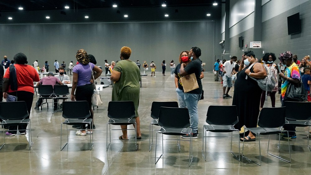 Image: People lined up at the Mississippi Trademart.