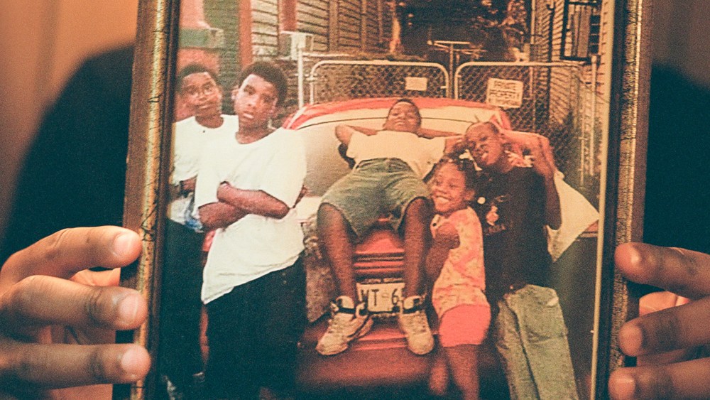 Image: Director Edward Buckles Jr. holding his family photo.