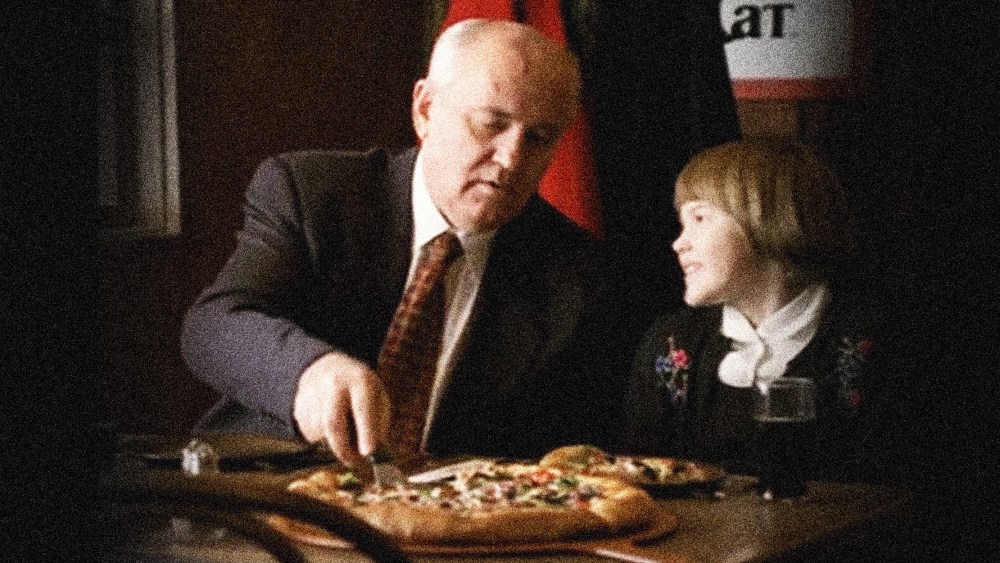 Image: Screengrab of Pizza Hut commercial showing Mikhail Gorbachev and child eating pizza.