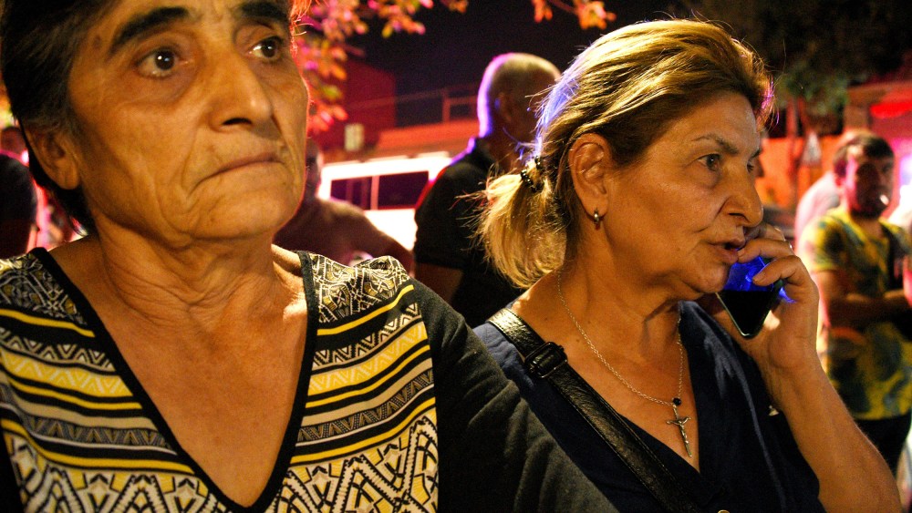 Relatives of servicemen, who were wounded in night border clashes between Armenia and Azerbaijan, gather outside a military hospital in Yerevan on Tuesday.