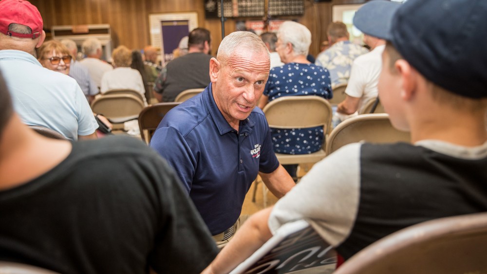 Republican Senate candidate Don Bolduc greets supporters at a town hall event on Sept. 10, 2022, in Laconia, N.H.