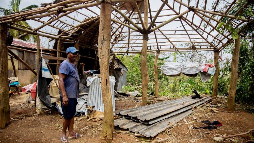 A man checks damages in a house near the highway connecting Miches with El Seibo in the northeast of the Dominican Republic on Thursday after the passage of Hurricane Fiona.