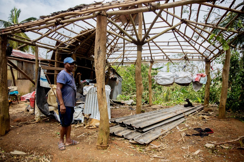 A man checks damages in a house near the highway connecting Miches with El Seibo in the northeast of the Dominican Republic on Thursday after the passage of Hurricane Fiona.