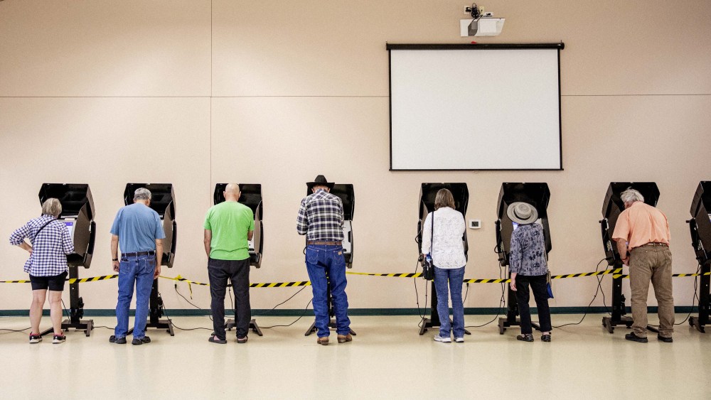 Voters cast ballots at a polling location at North Christian Church in Cheyenne, Wyo. on Aug. 16.