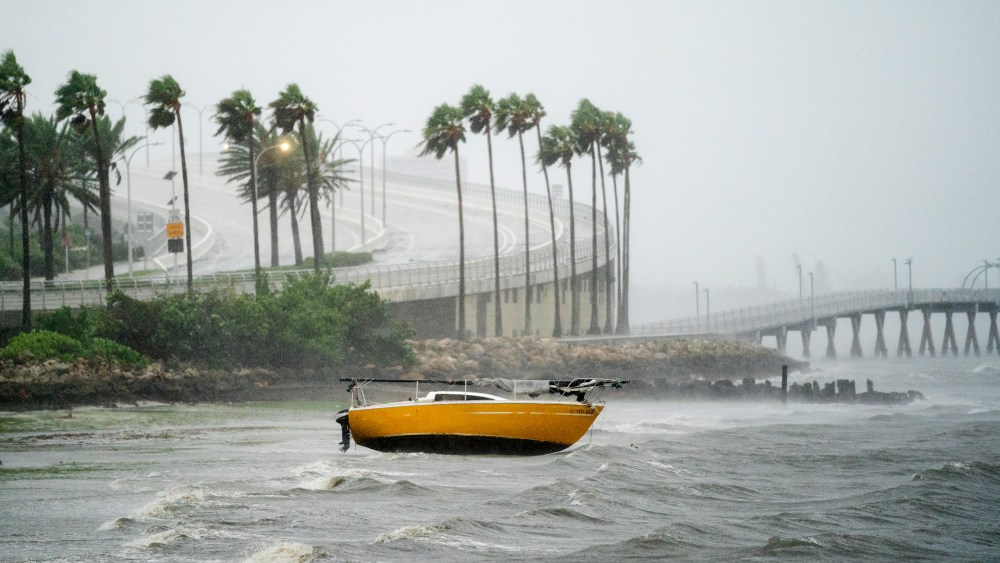 Image: A sail boat is beached at Sarasota Bay as Hurricane Ian approaches Florida.