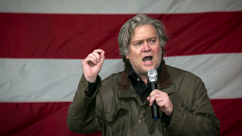Image: Steve Bannon speaking against an American flag in the background.