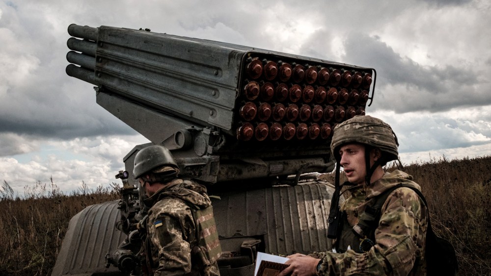 Image: Ukrainian soldiers prepare to fire a BM-21 multiple rocket launcher towards Russian positions in the Kharkiv region on Oct. 4, 2022.