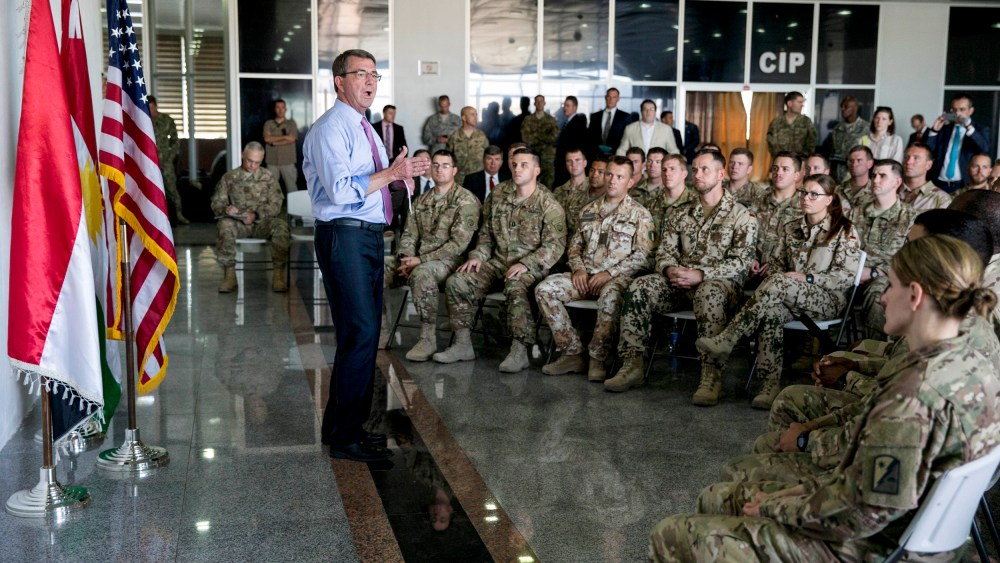 Defense Secretary Ash Carter talks to multinational troops at the Irbil International Airport on July 24, 2015, in Irbil, Iraq.