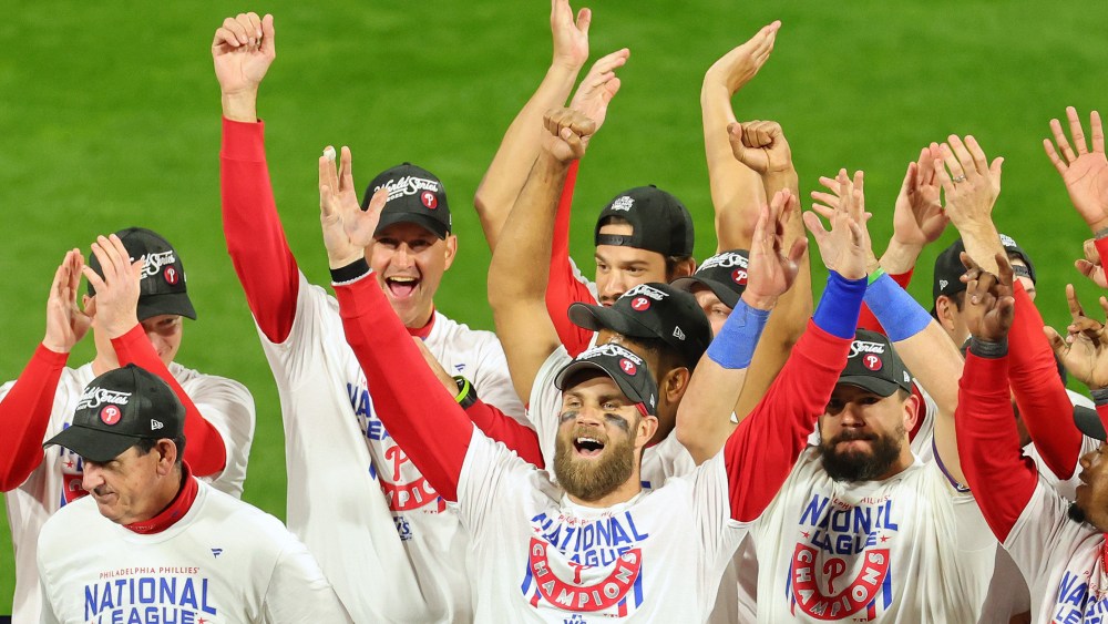 Image: Bryce Harper #3 of the Philadelphia Phillies celebrates with teammates.