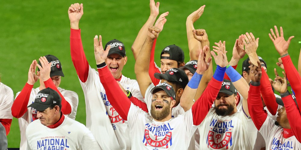 Image: Bryce Harper #3 of the Philadelphia Phillies celebrates with teammates.
