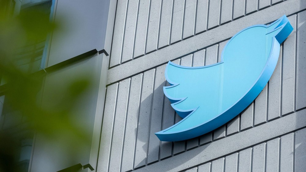 Image: The Twitter logo is seen on a sign on the exterior of Twitter headquarters in San Francisco, California.