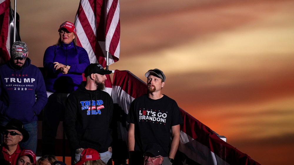 Image: Supporters of Donald Trump wearing t-shirts that read "TRUMP 2024" and "Let's go Brandon".