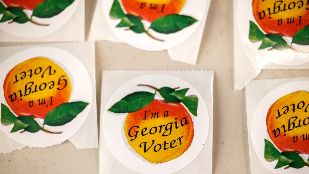Image: Stickers with peaches and text that read,"I'm a Georgia Voter".