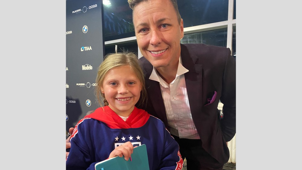 Abby Wambach poses with 9-year-old fan Addison Kuhl at the inaugural USWNT Player's Ball on Nov. 14, 2022, commemorating the Player's historical equal pay agreement.