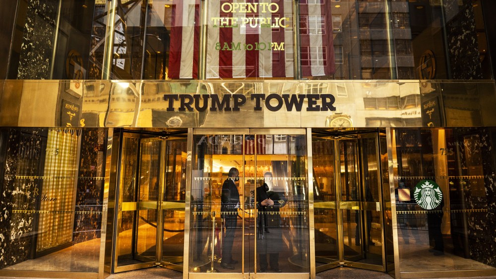 Image: Security guards stand at the entrance to Trump Tower in New York.