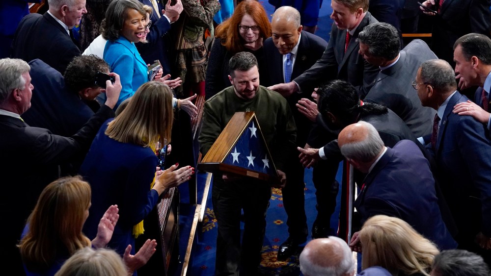 Image: Ukrainian President Volodymyr Zelenskyy holds an American flag gifted to him by Speaker Nancy Pelosi after he addressed a joint session of Congress at the Capitol in Washington on Dec. 21, 2022.