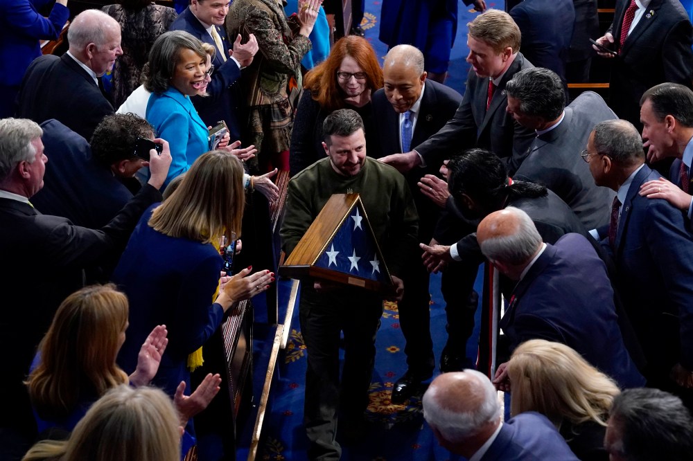 Image: Ukrainian President Volodymyr Zelenskyy holds an American flag gifted to him by Speaker Nancy Pelosi after he addressed a joint session of Congress at the Capitol in Washington on Dec. 21, 2022.