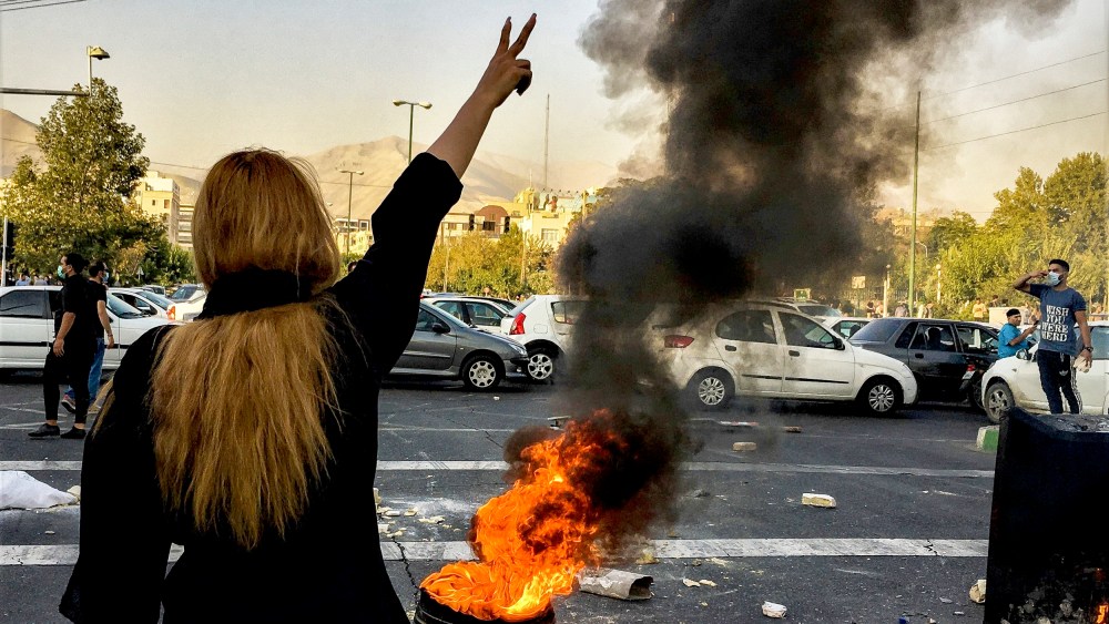 Iranians protests the death of 22-year-old Mahsa Amini in Tehran, on Oct. 1, 2022.