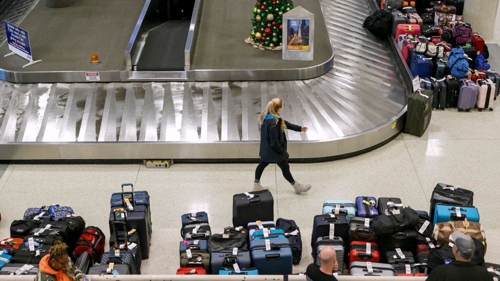 Image: Stranded Southwest Airlines passengers look for their luggage at baggage claim at Chicago Midway International Airport on Dec. 28, 2022.