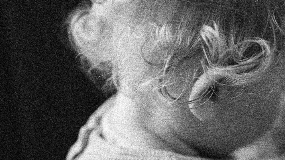 Image: A close up of a baby's head.