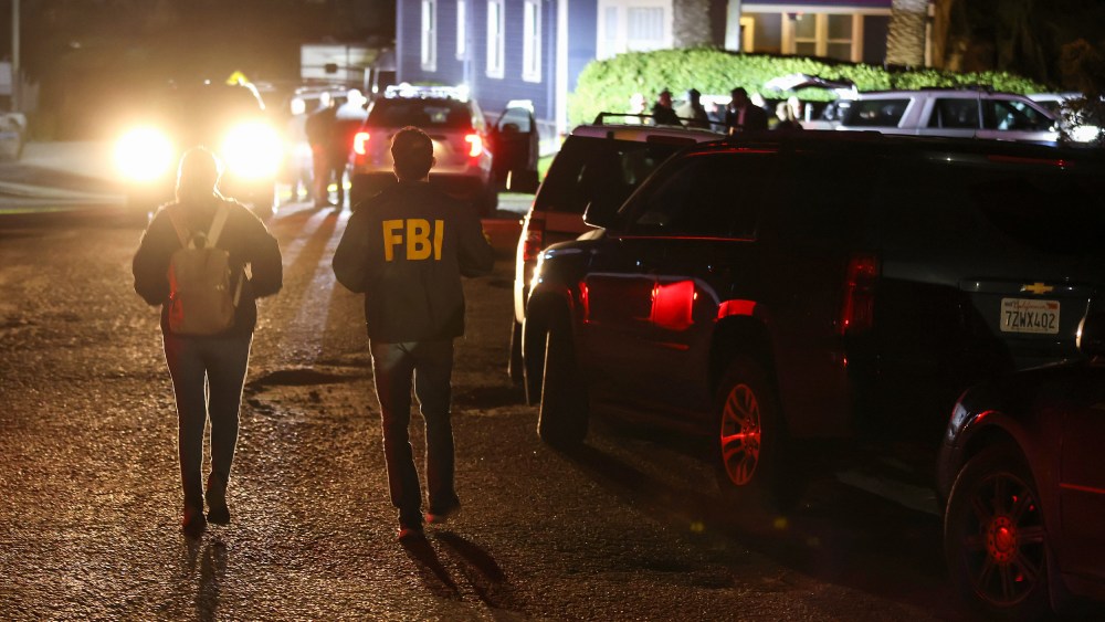 FBI agents arrive at the scene of a shooting on Jan. 23, 2023, in Half Moon Bay, Calif.