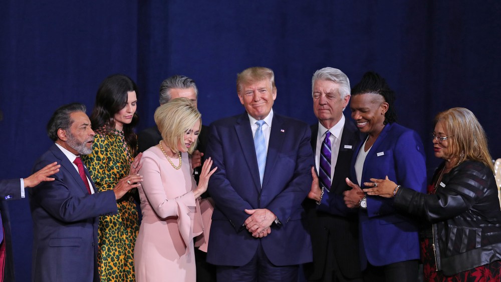 Faith leaders pray over President Donald Trump during a "Evangelicals for Trump" campaign event at the King Jesus International Ministry on Jan. 3, 2020 in Miami.