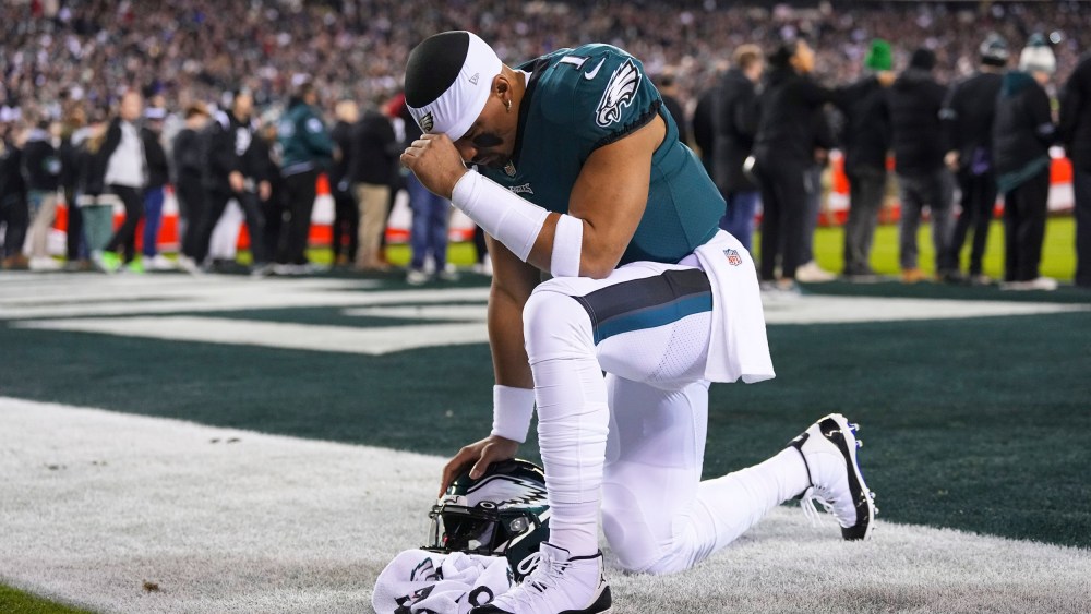 A member of the Philadelphia Eagles prays during a football game in Philadelphia