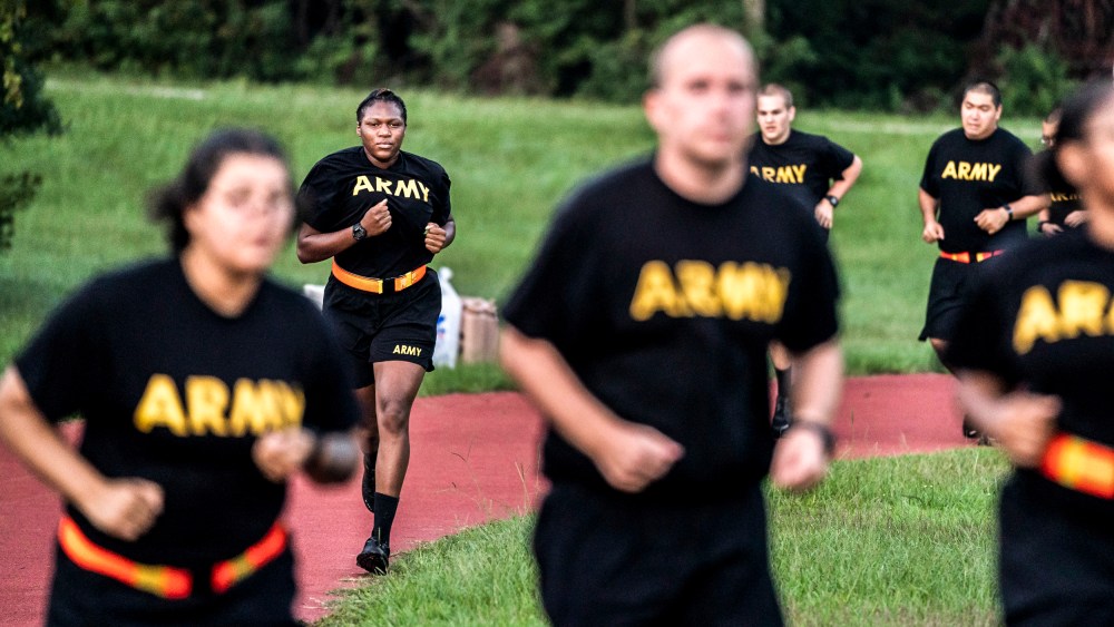 Image: Students in the new Army prep course run around a track during physical training exercises at Fort Jackson in Columbia, S.C., on Aug. 27, 2022.