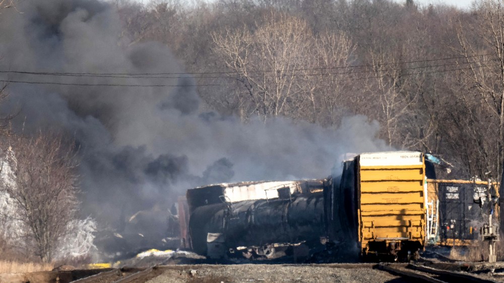 Smoke rises from a derailed cargo train in East Palestine, Ohio, on Feb. 4, 2023.